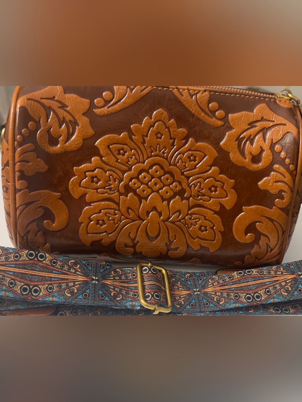Embossed Floral Leather Crossbody Barrel-style Brown Bag with Patterned Straps